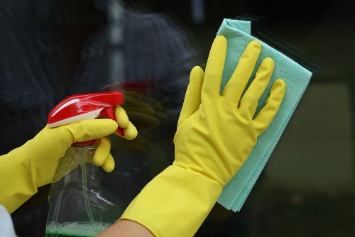 Cleaning professional applying safety measures with protective gear