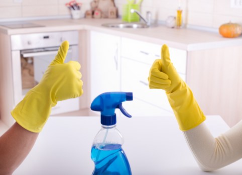 Cleaner inspecting a completed room after a quality concern