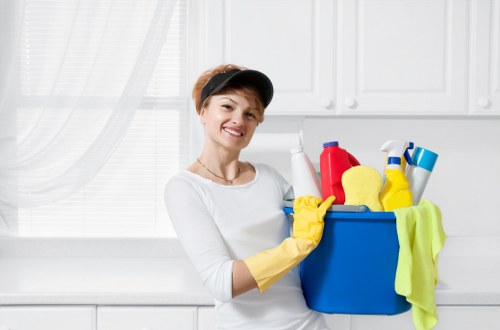 Staff member reviewing safety procedures during cleaning work